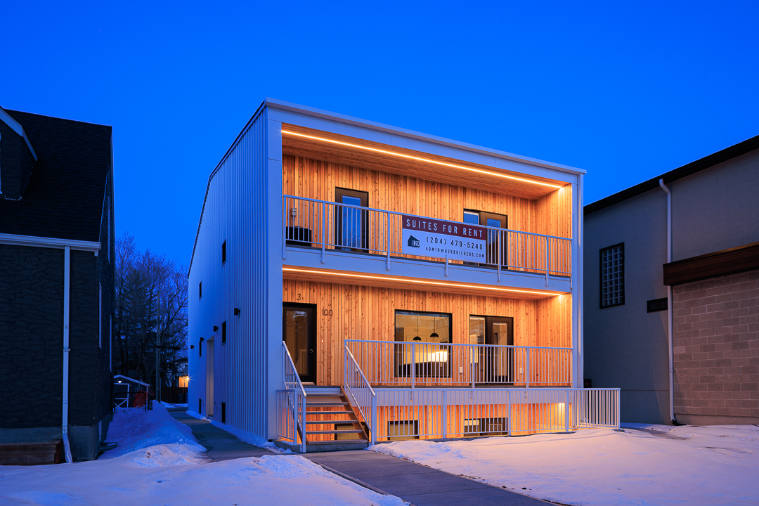 Full building facade at twilight